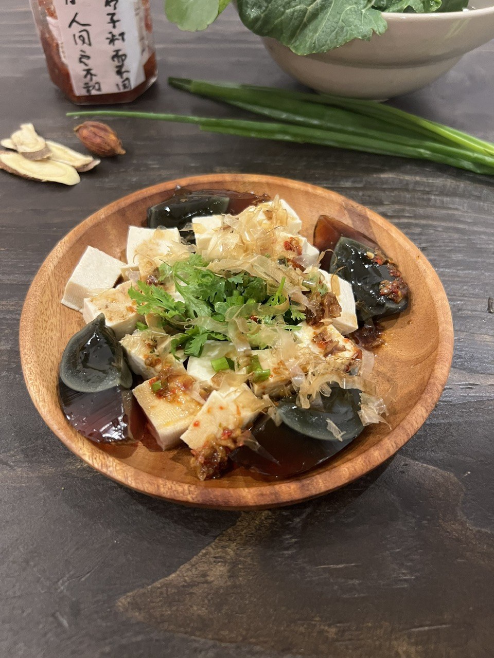 Century-egg tofu on a wooden plate