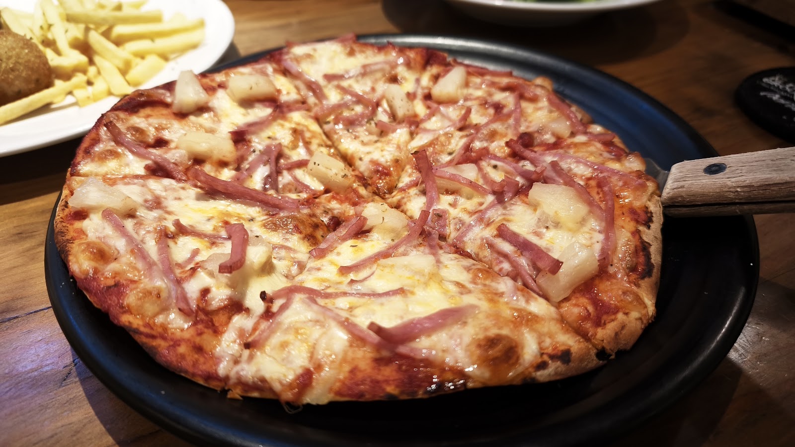 Hawaiian pizza with ham and pineapple