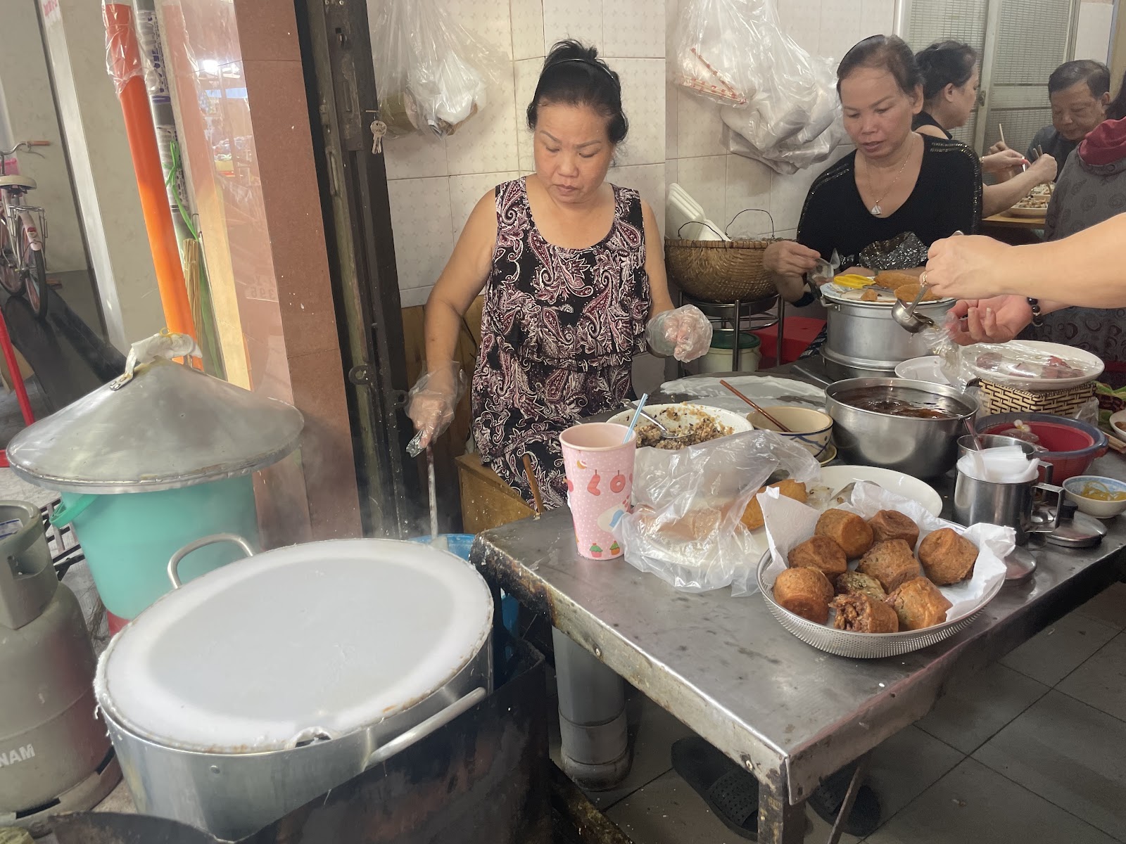 An early-market customer's plate of bánh cuốn (photo pass pending)