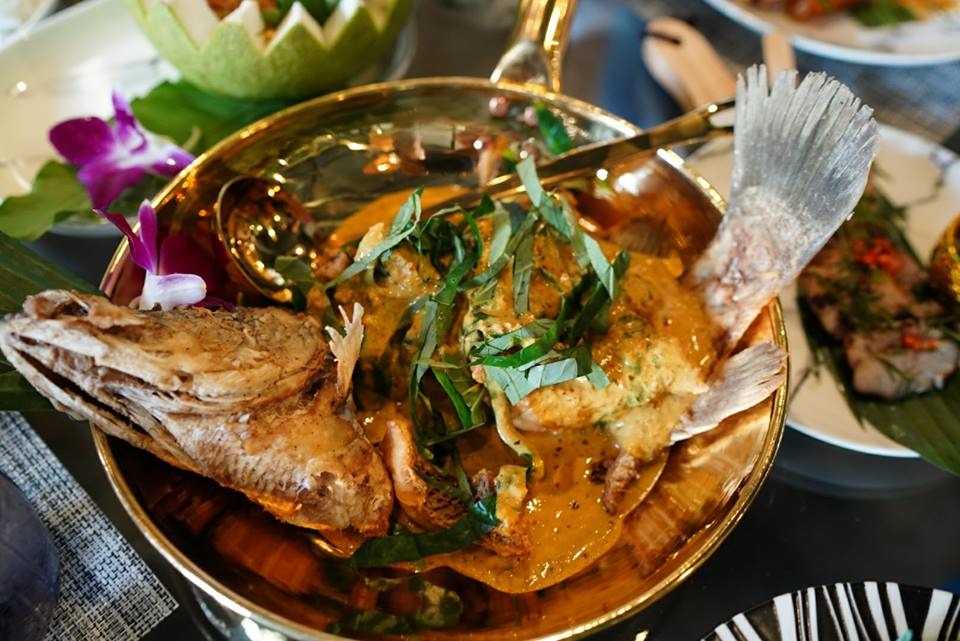 Fish curry in a brass pot
