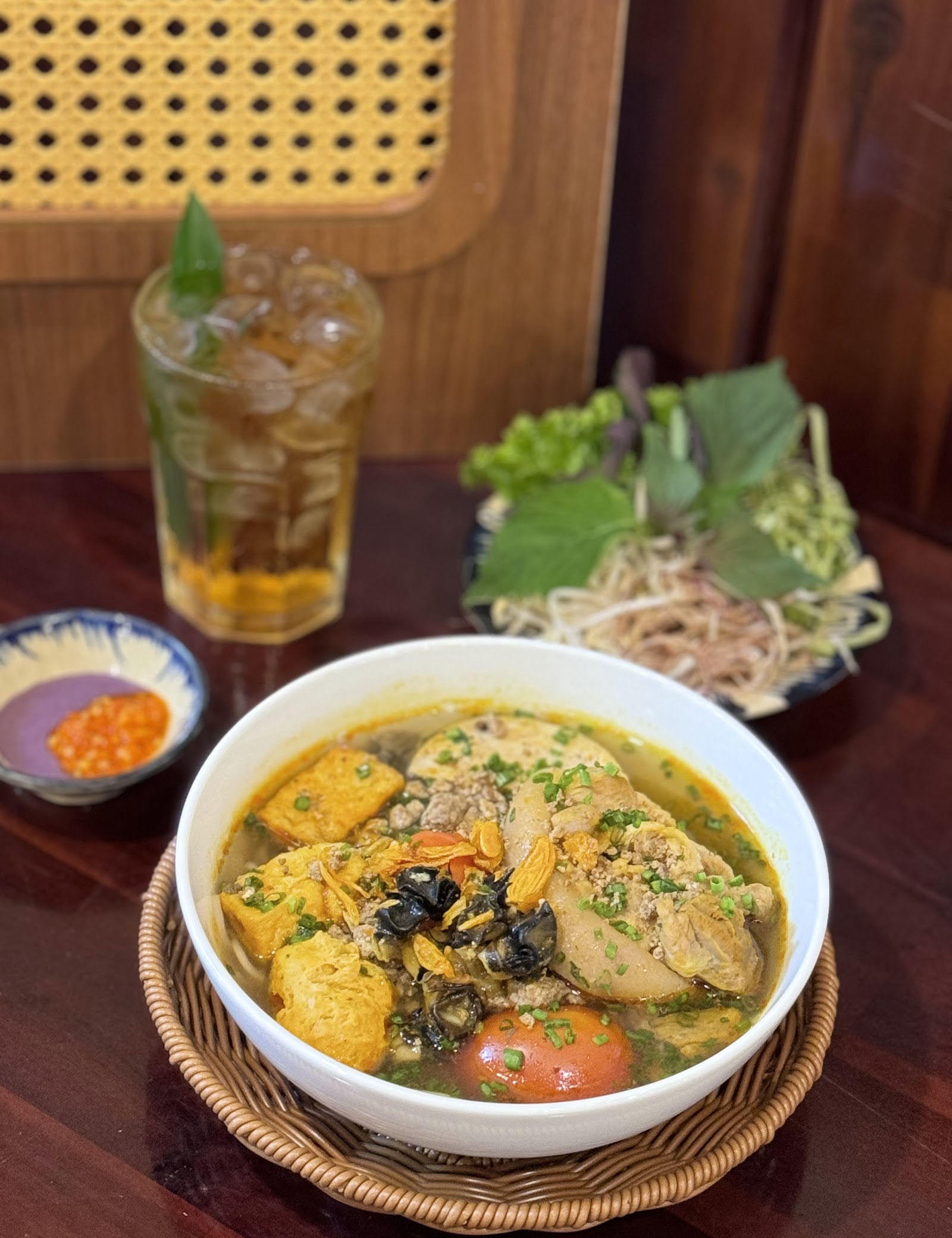 Field-crab sheets in the bún riêu bowl — pending the venue photo pass (10/2026)