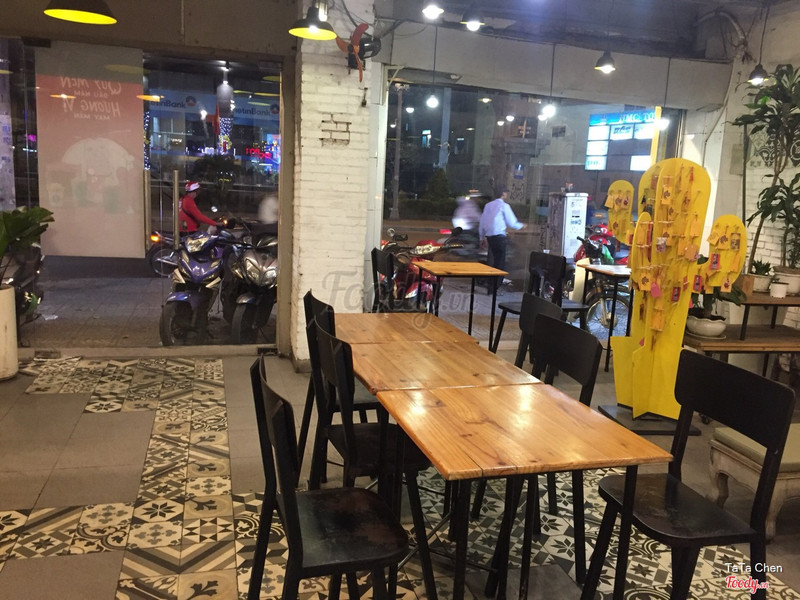 The shop interior from the street front, the yellow cactus inside