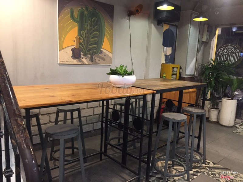 The high table with cactus art on the wall