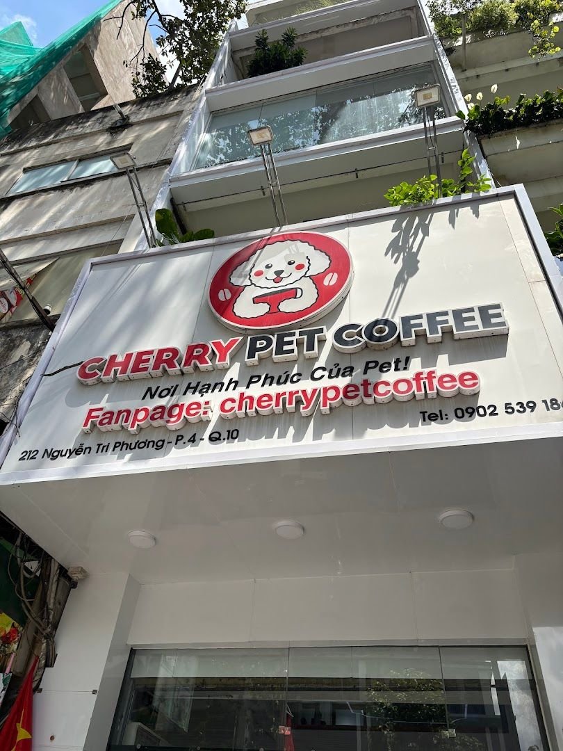 The daytime frontage, smiling-poodle logo