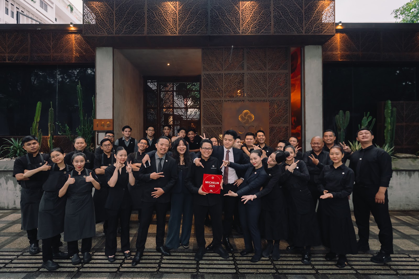 The CoCo team with the MICHELIN 2025 plaque