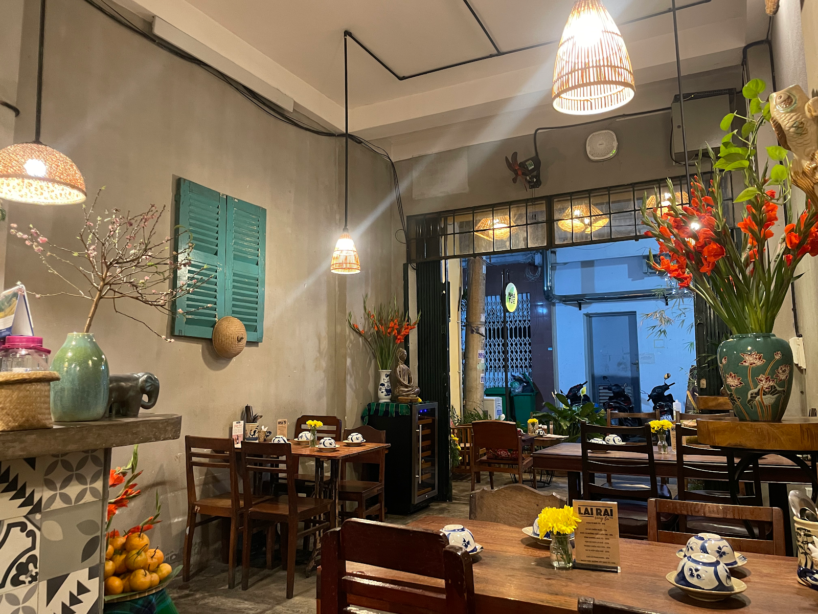 Warm dining room with bamboo pendant lamps and wooden tables