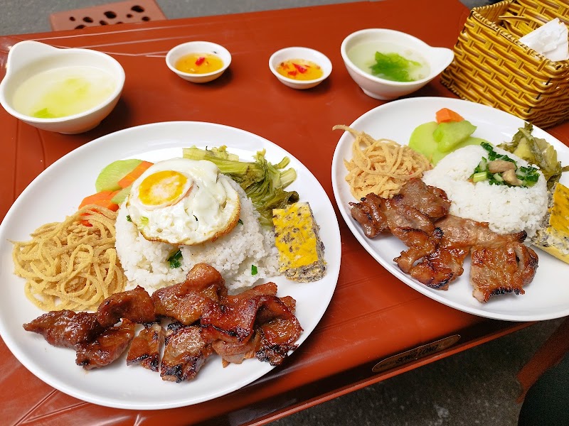 Two plates of Long Xuyen-style rib-and-loaf com tam at Cay Diep