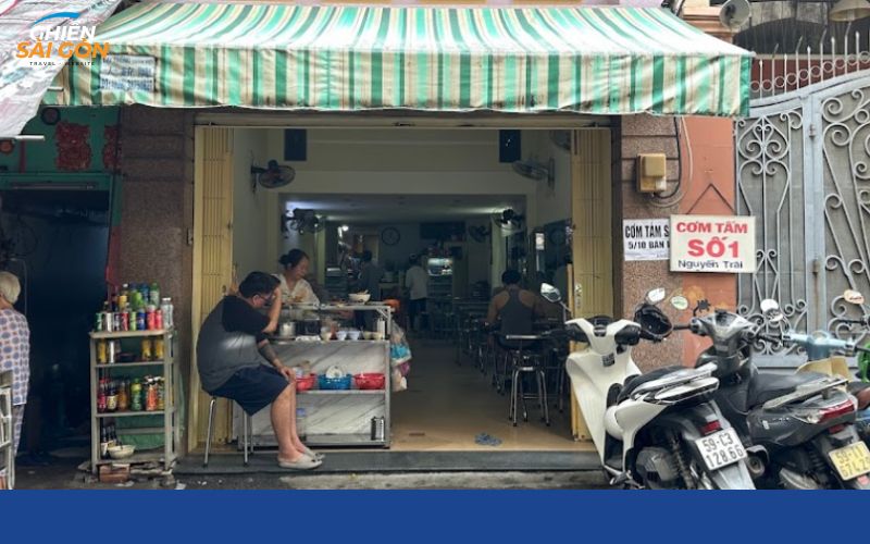 The shopfront under the striped awning