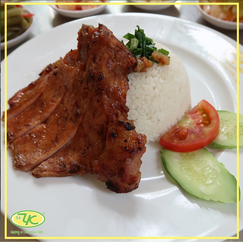 Grilled-rib rice plate — golden grilled ribs, pork skin, pickles