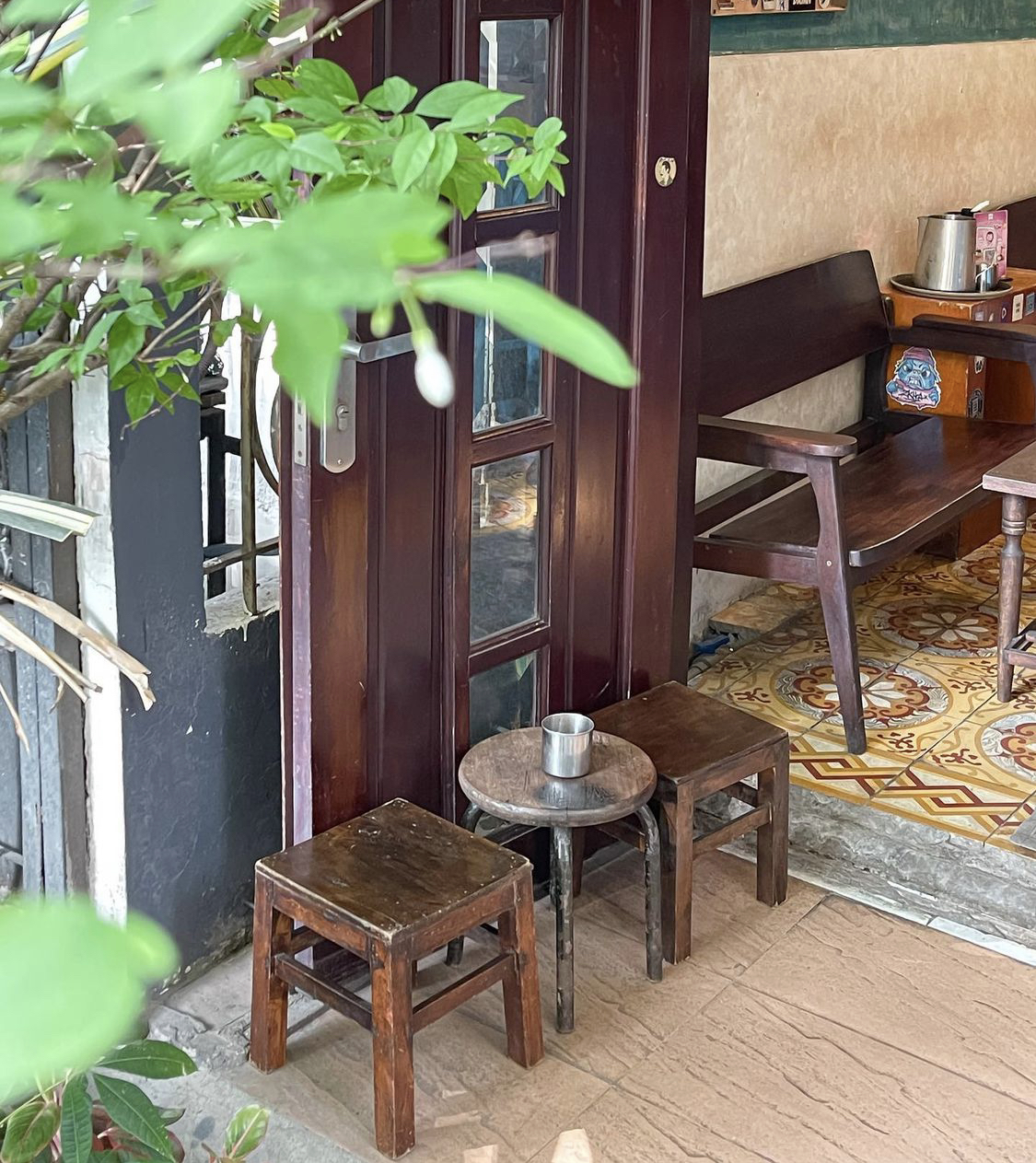 The maroon folding wooden doors flung open