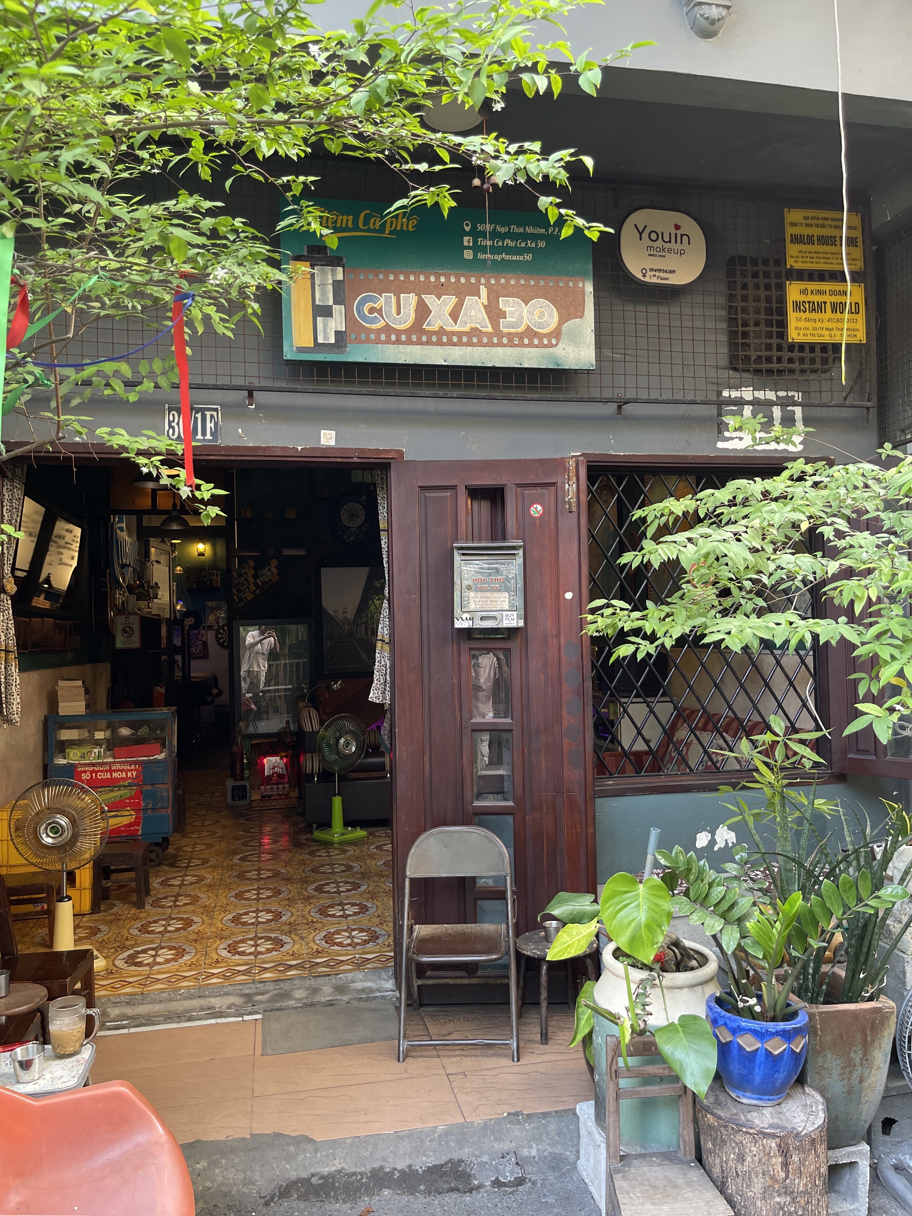 The maroon hand-painted sign above the storefront