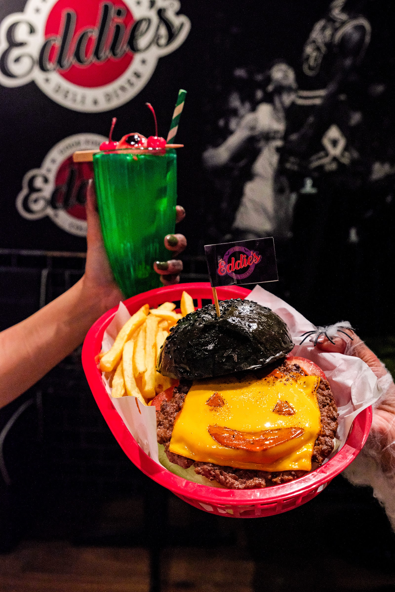 A black-bun cheeseburger — the house showstopper