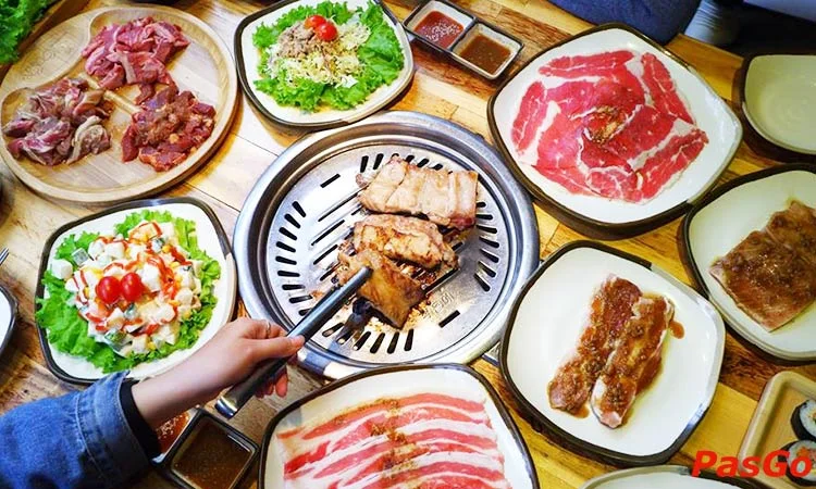 Meat grilling on the table, tongs in action (another branch, pasgo.vn)