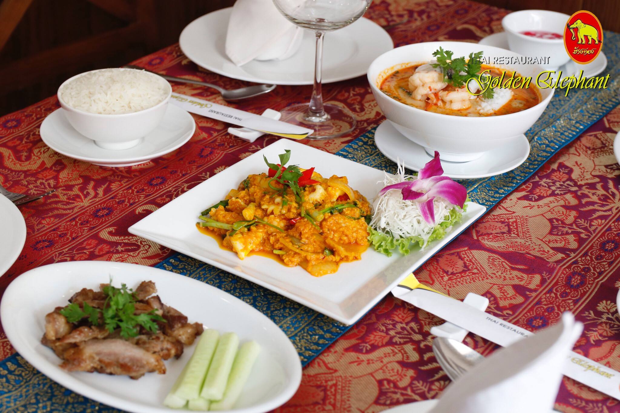 A Golden Elephant spread: shrimp tom yum, curry, roast duck