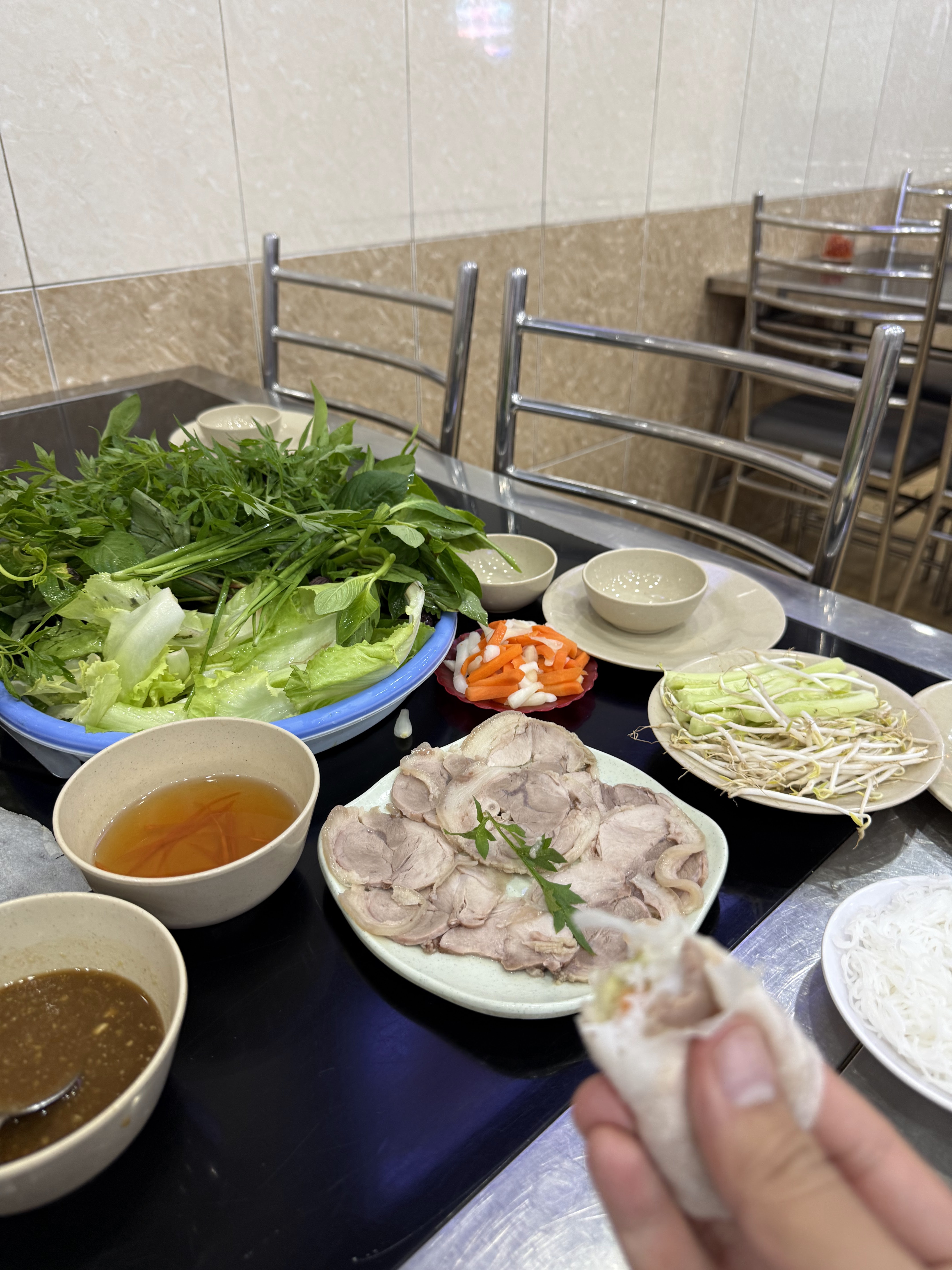Rolling rice paper by hand at the table