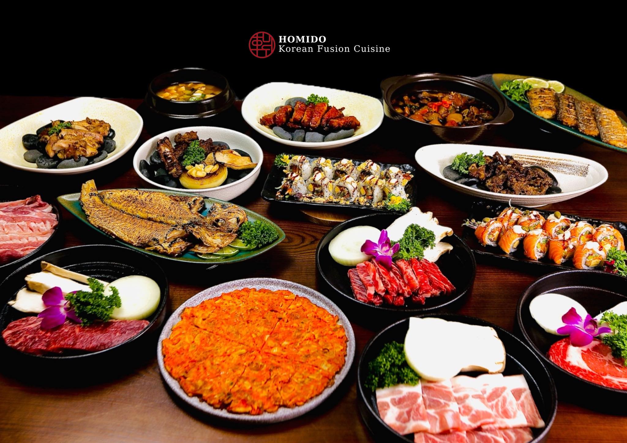 The house fusion spread: grilled meats, kimchi pancake, kimchi stew