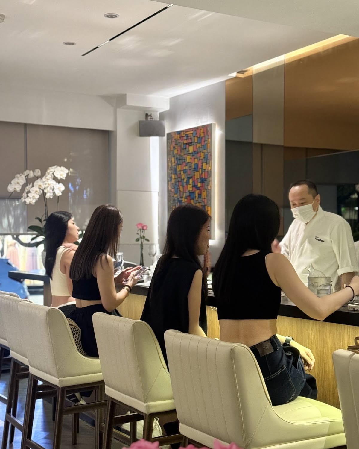 The chef serving guests at the Kasen counter