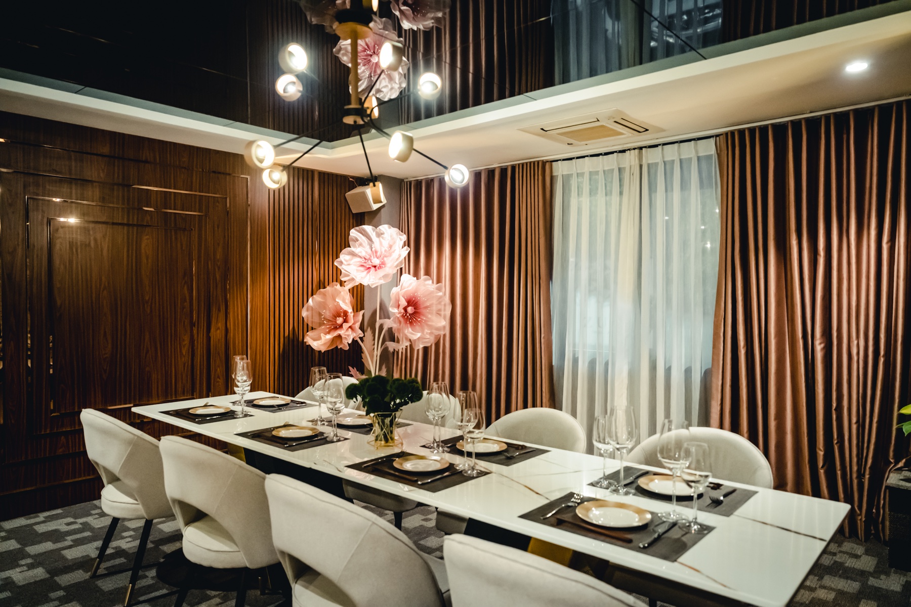 Kasen's private room with wine glasses beneath an abstract painting