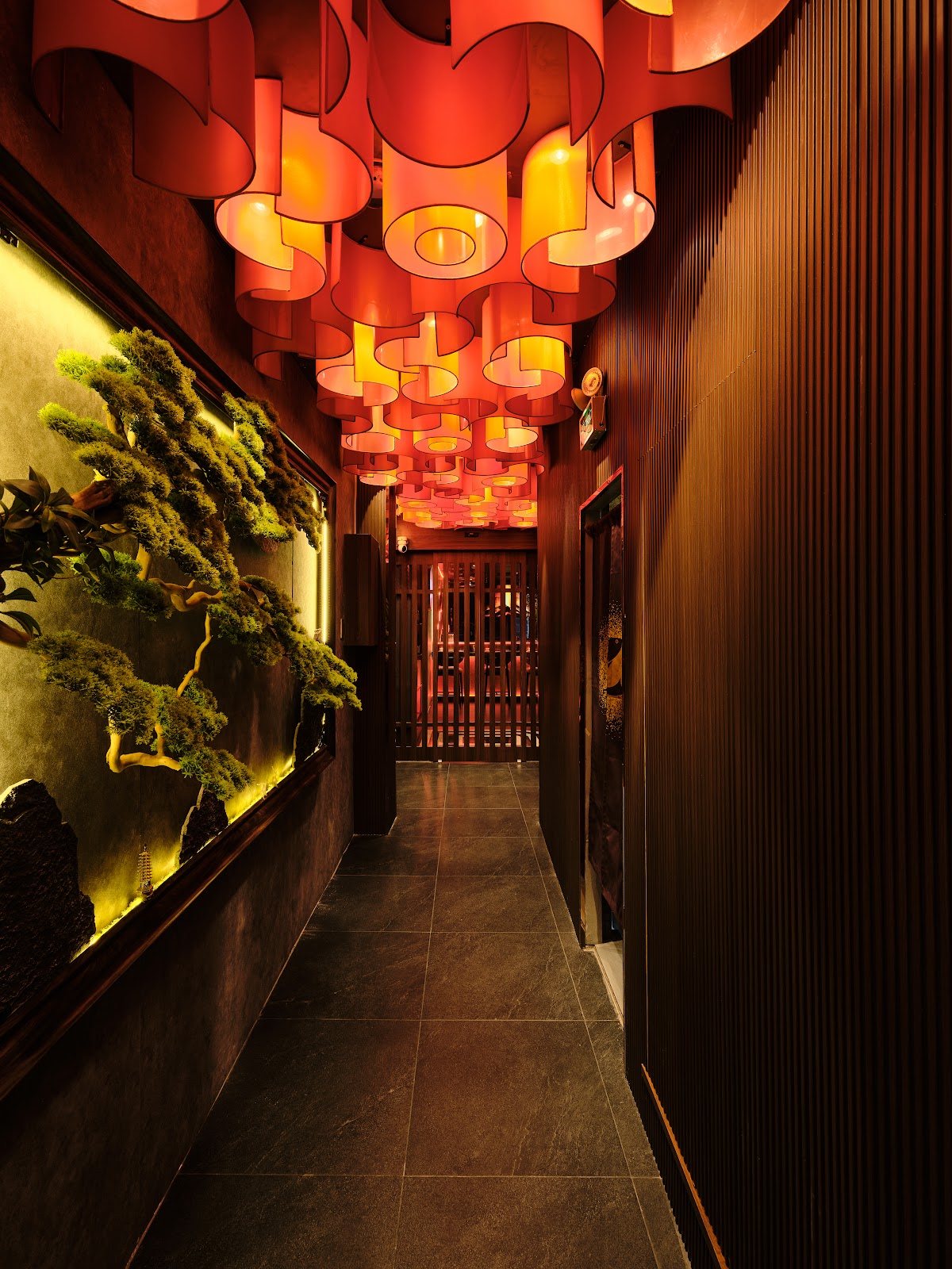 The lantern corridor — cascading red-orange paper lanterns