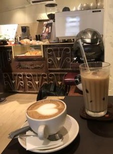 The carved wooden counter with the pastry case
