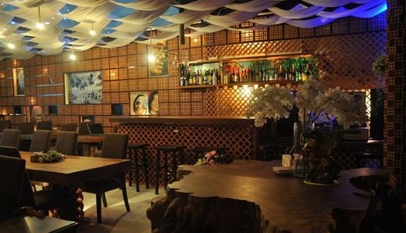 The in-venue bar: brick lattice, artist portraits