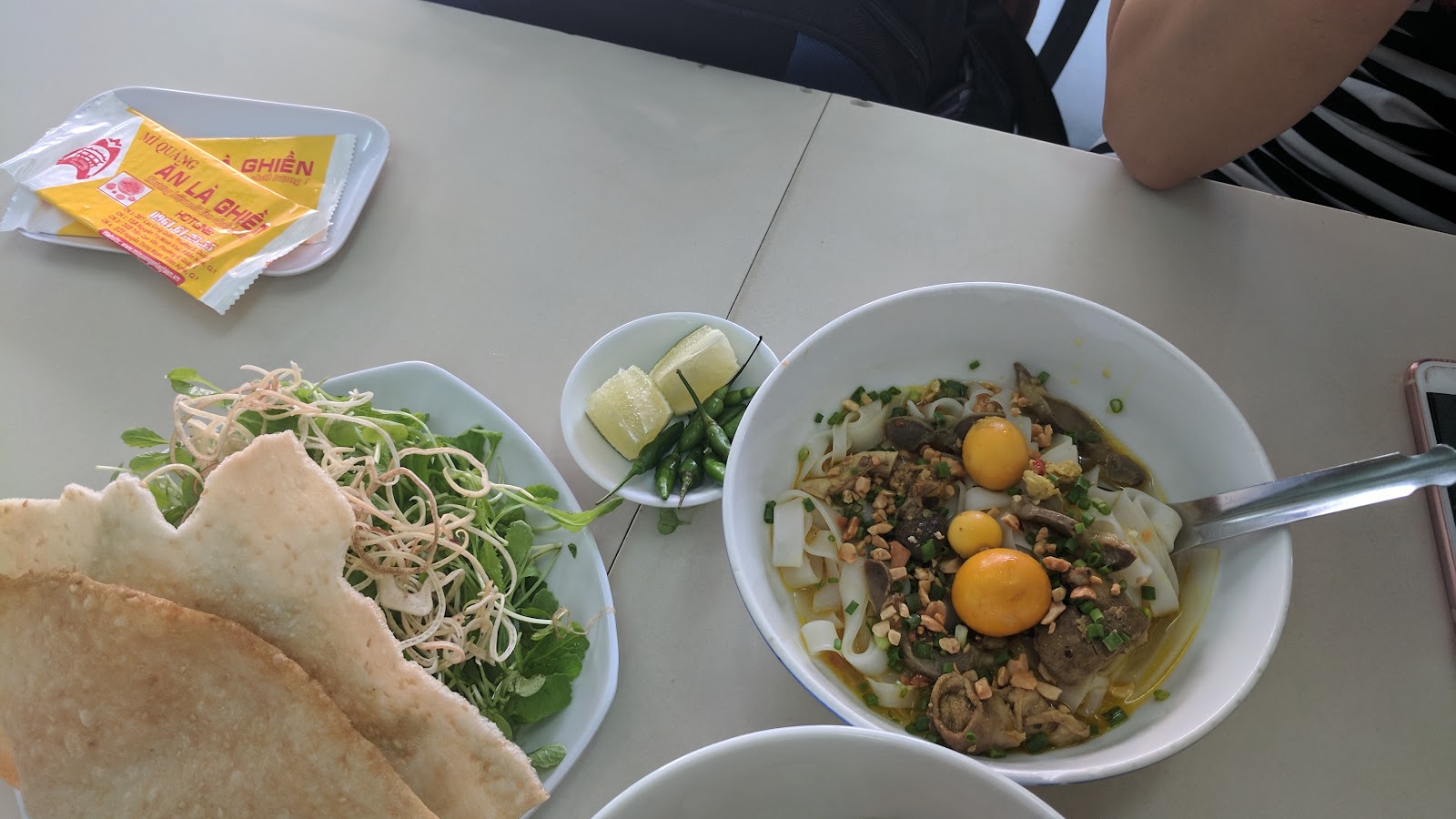 The golden Ăn Là Ghiền mì quảng bowl (pending the venue photo pass)