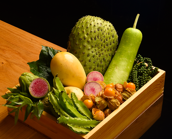 A wooden box of fresh produce at NORIBOI
