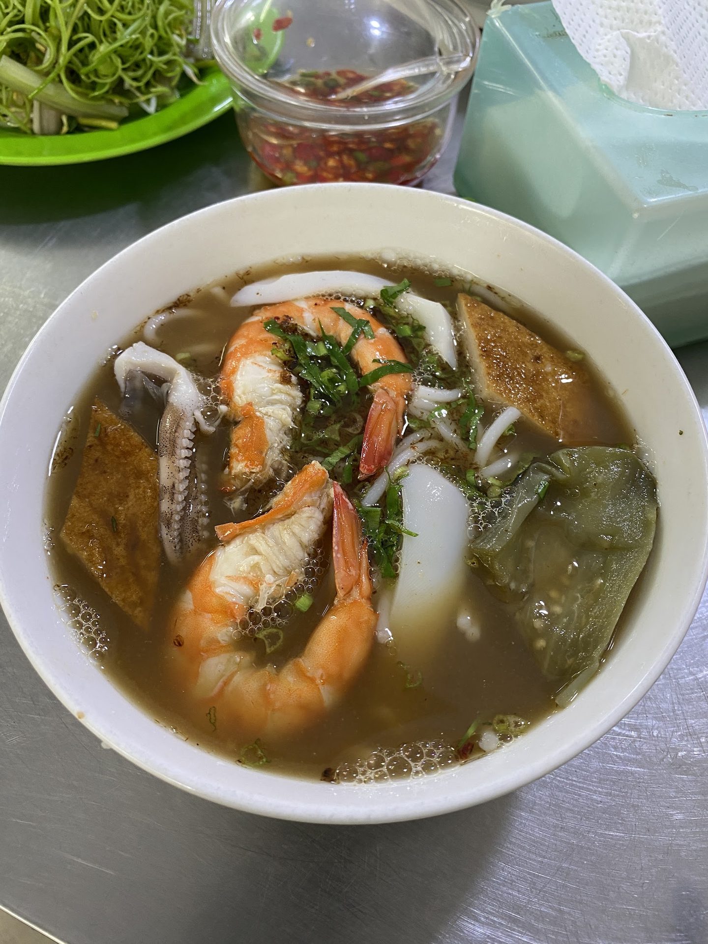 Seafood noodle soup with prawns, squid and fish cake.