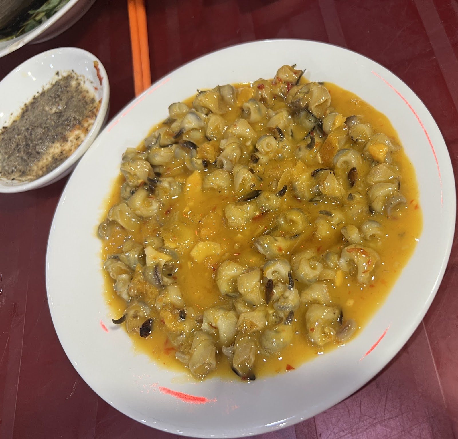 Butter-sautéed snails — the house signature.