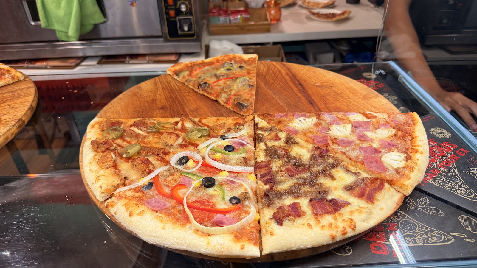 Several pizzas in boxes