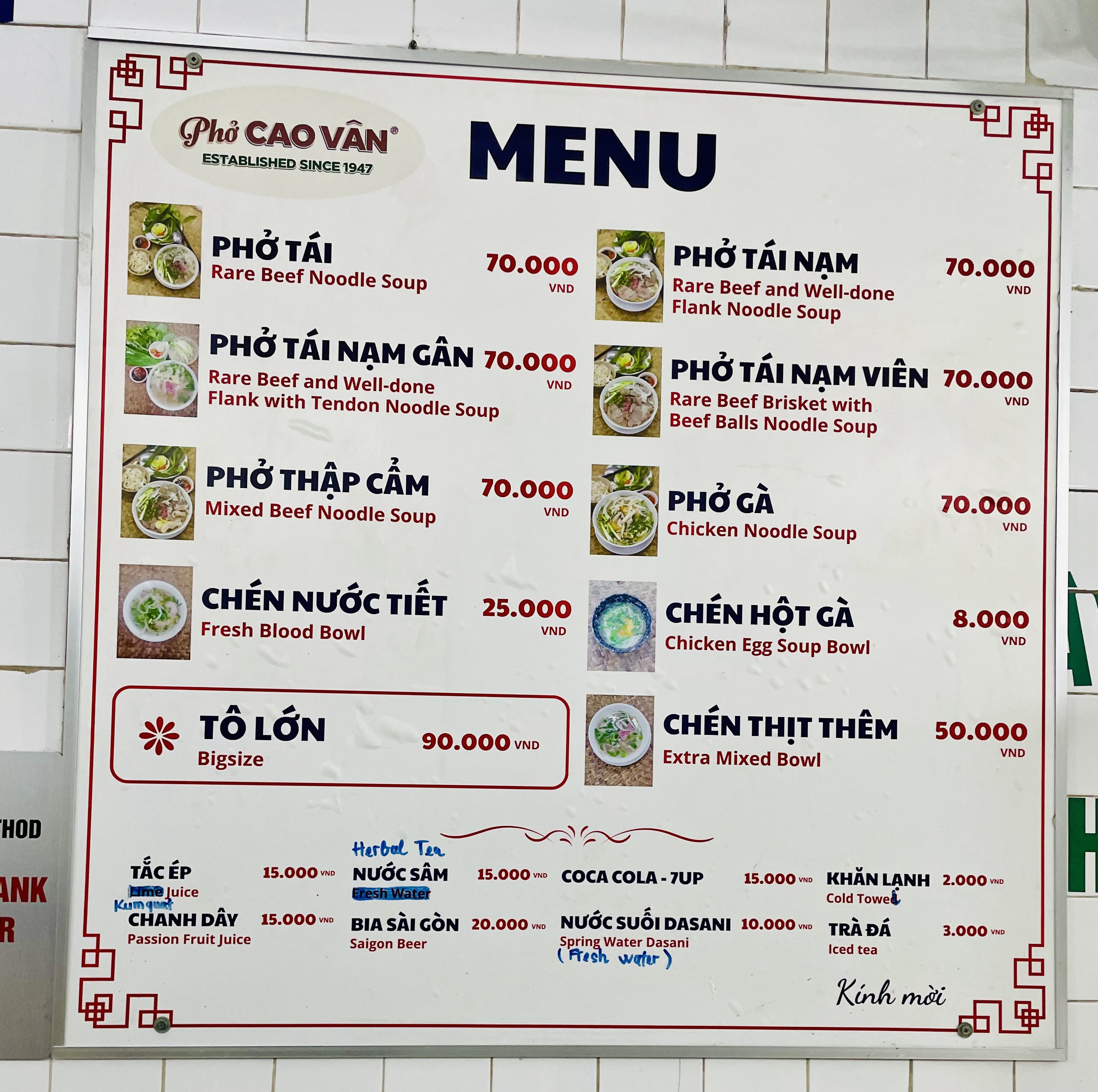 The red price board inside Phở Cao Vân