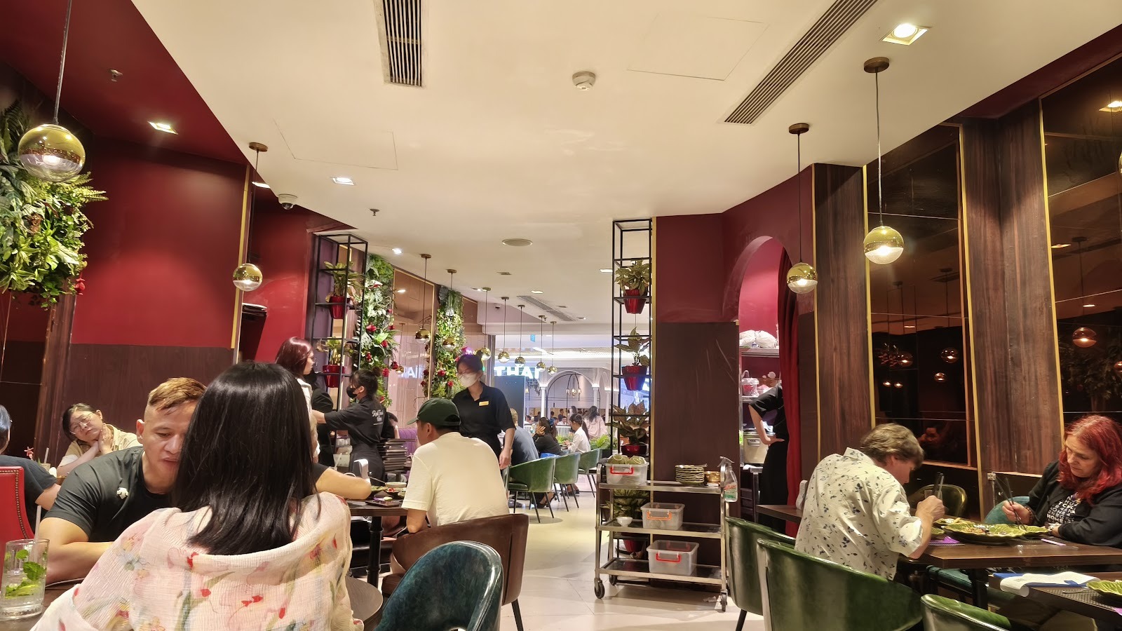 The dining room, red walls and green chairs