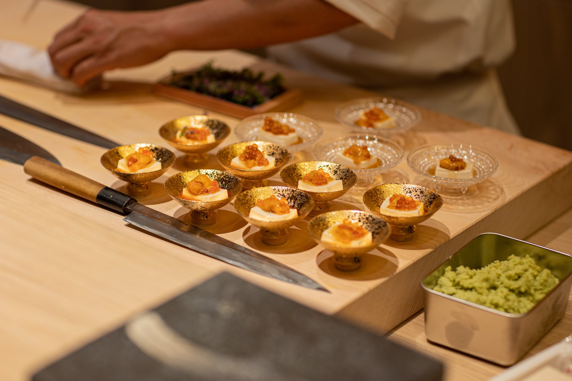 Uni and ikura cups on the hinoki counter