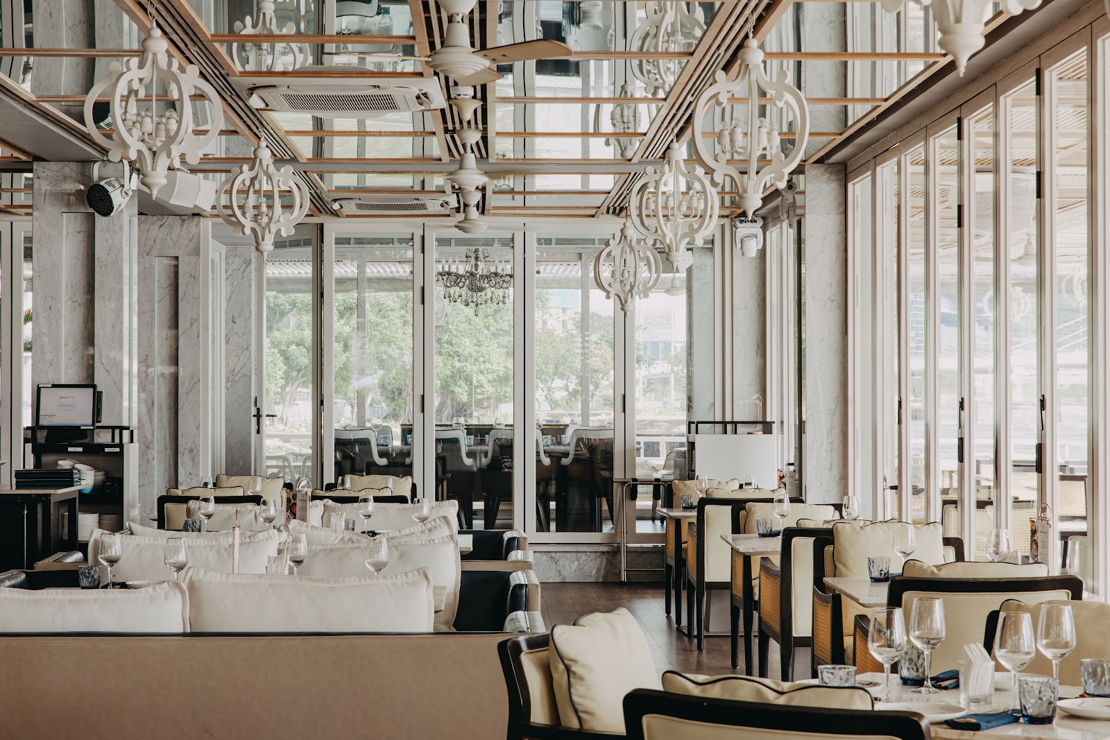 The dining room under white chandeliers