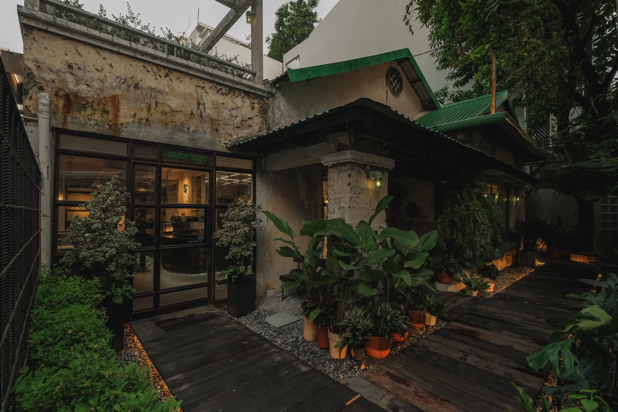 S'mores Saigon — the courtyard at dusk, SINCE 2020 glass doors