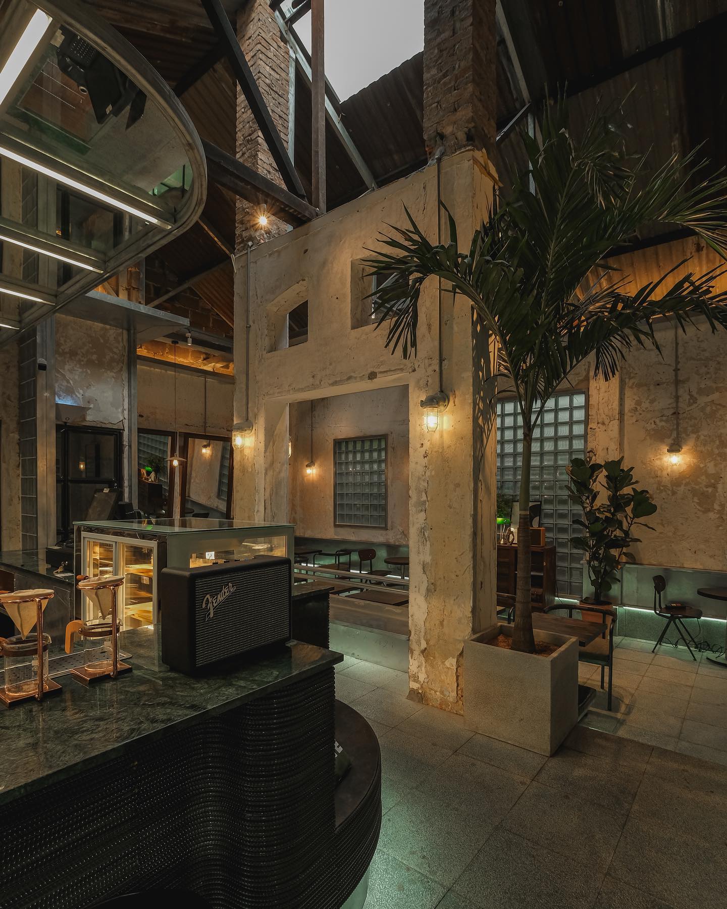 S'mores Saigon — the inner hall: glass-brick walls, corrugated roof
