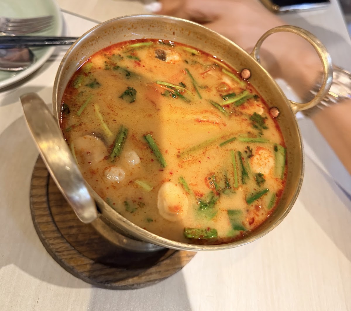 Tom Yum hot pot in a brass pot