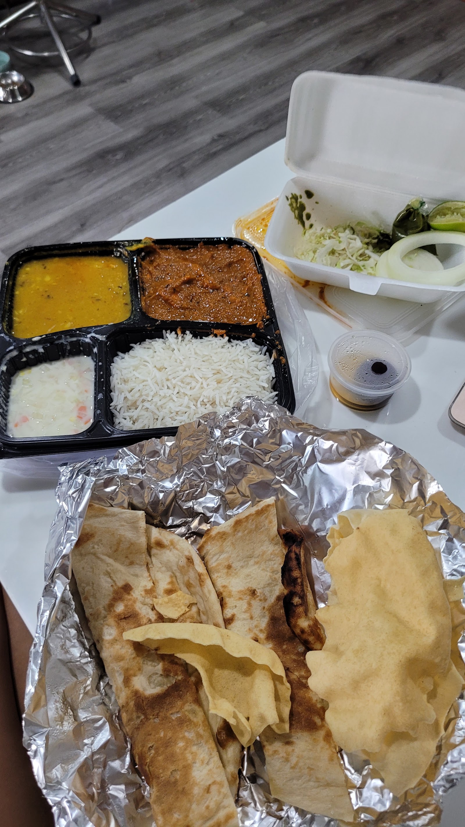 Thali tray: dal, curry, raita, rice and breads
