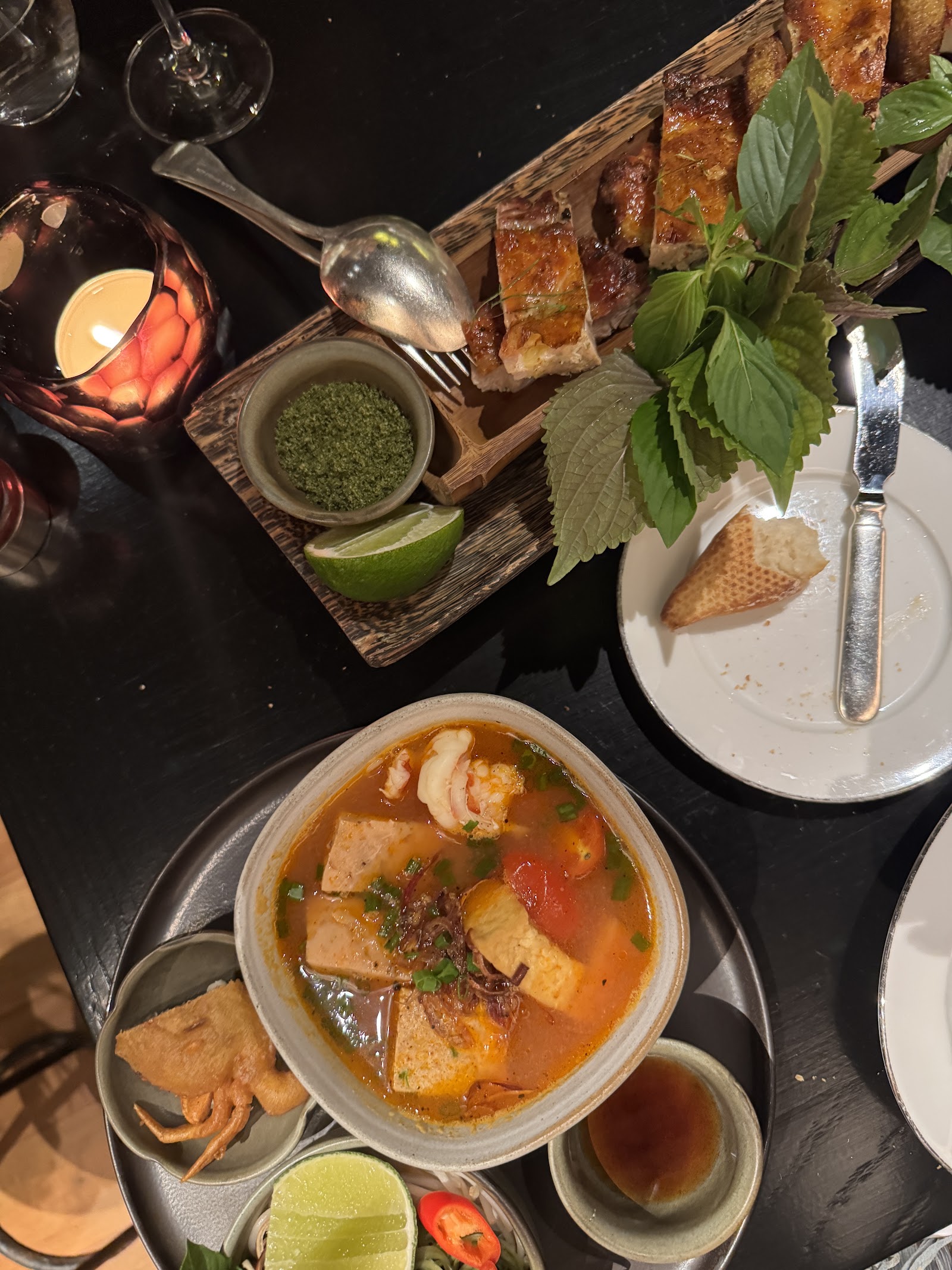 Steaming Vietnamese soup with a platter of sliced roasted meat — visitor Chloe's photo, Sep 2026
