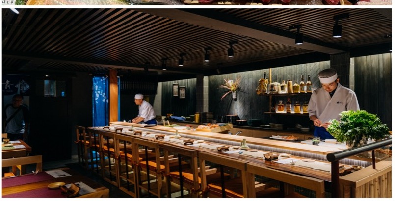 The long wooden counter at Sushi Aoyama with chefs at work