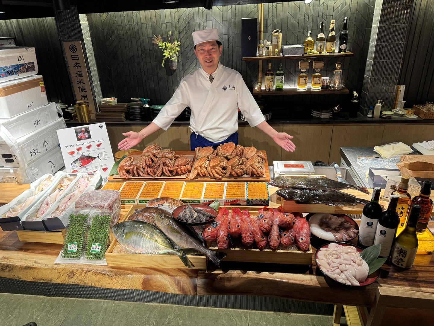 The chef presenting the morning's seafood: hairy crabs, uni, whole fish and wagyu