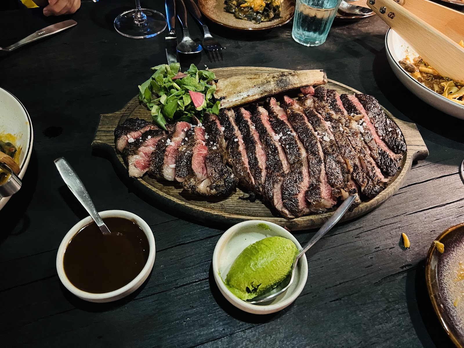Sliced tomahawk on a wooden board