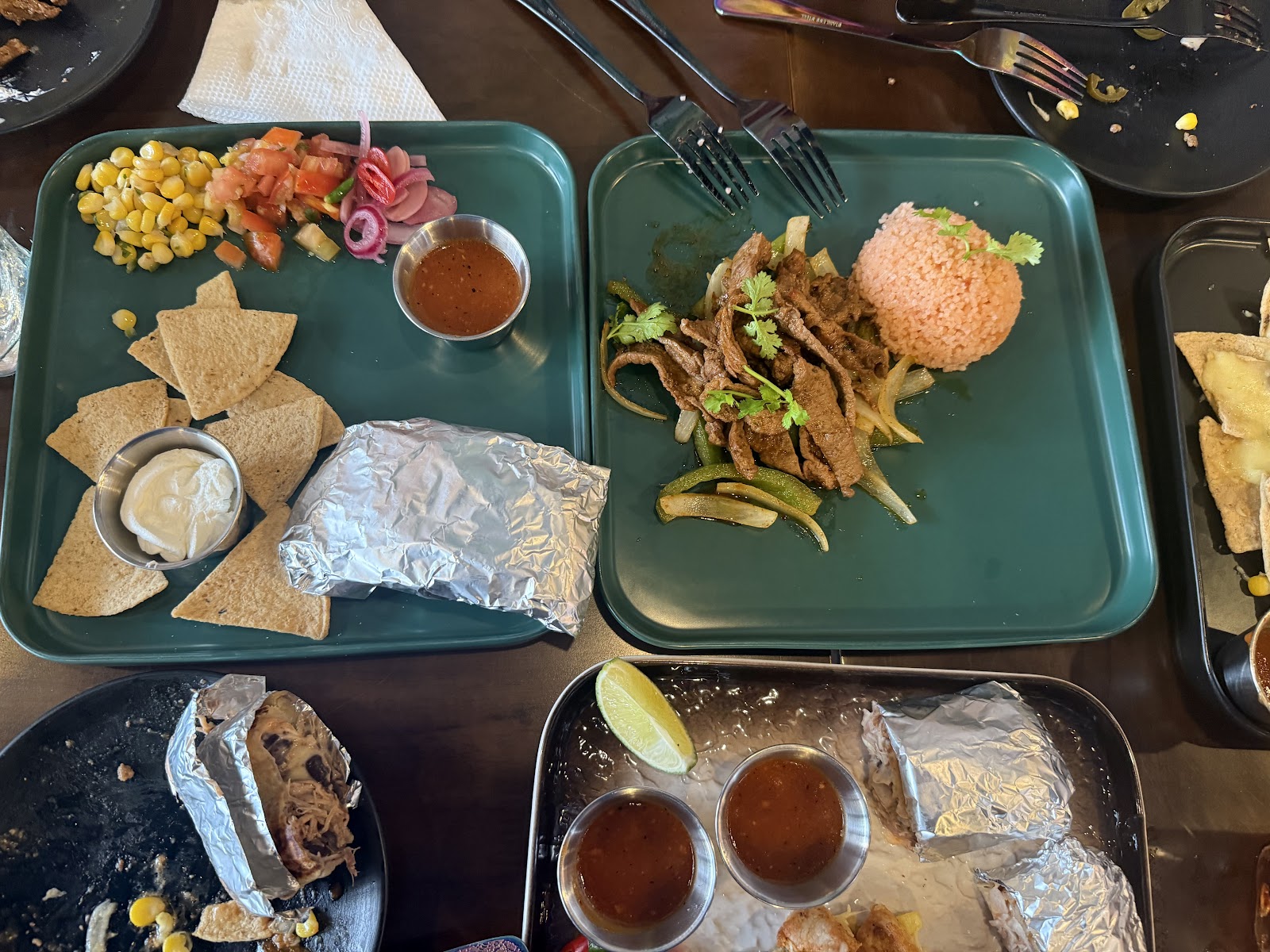 Foil-wrapped burritos and steak fajitas