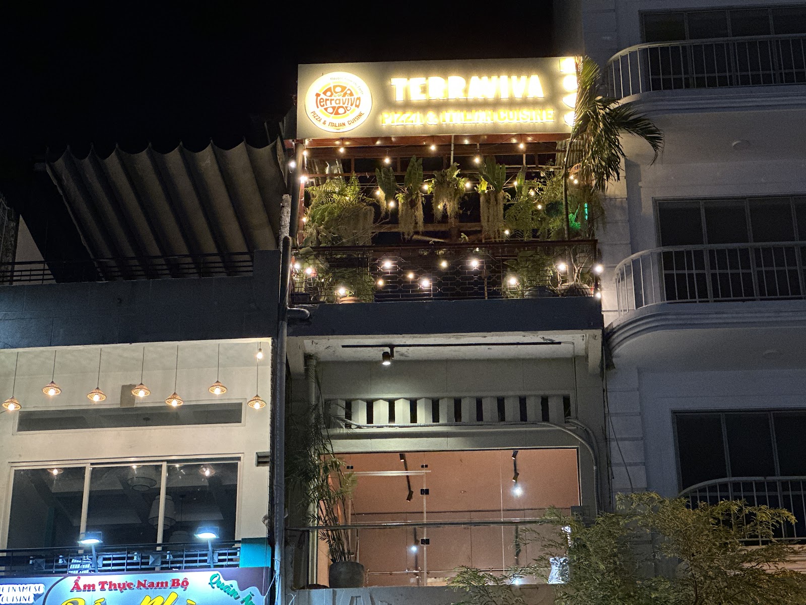 The Terraviva facade at night