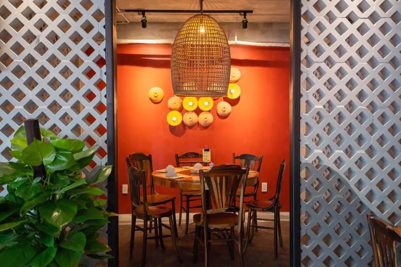 Orange dining room, rattan lamps