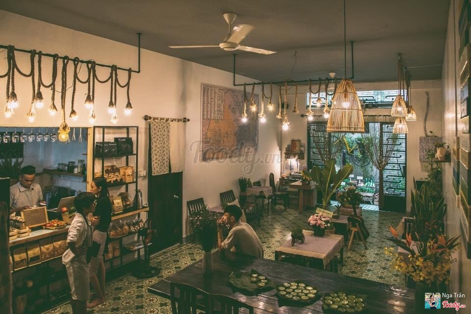 The green interior under Edison bulbs