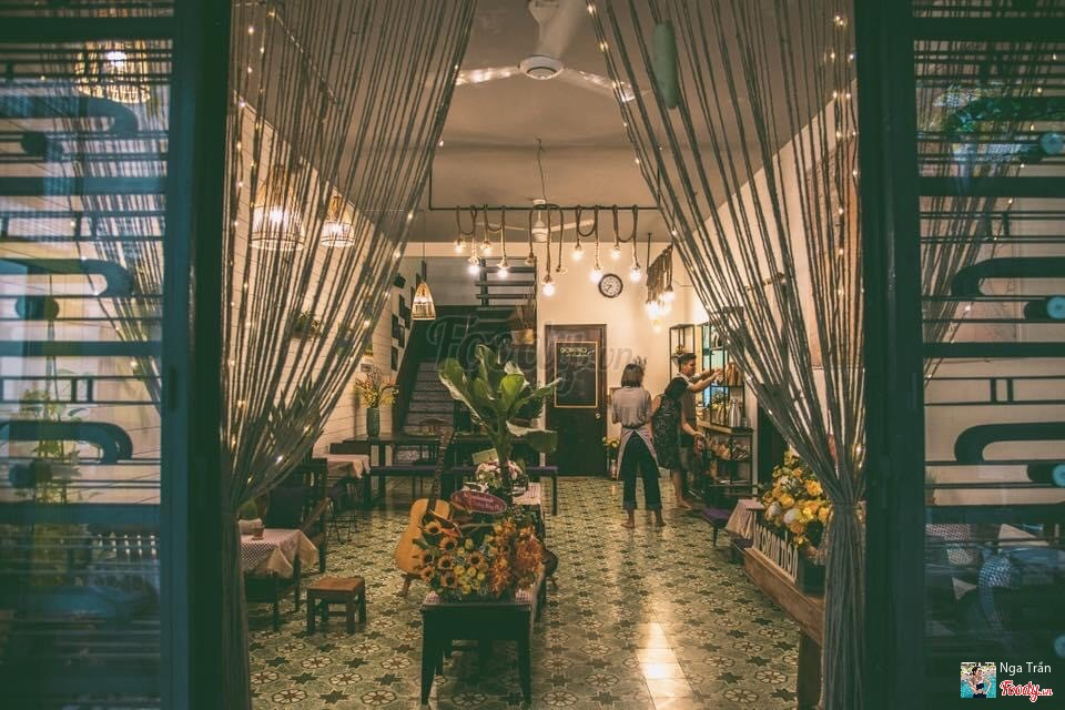 The interior with string curtains and Edison bulbs