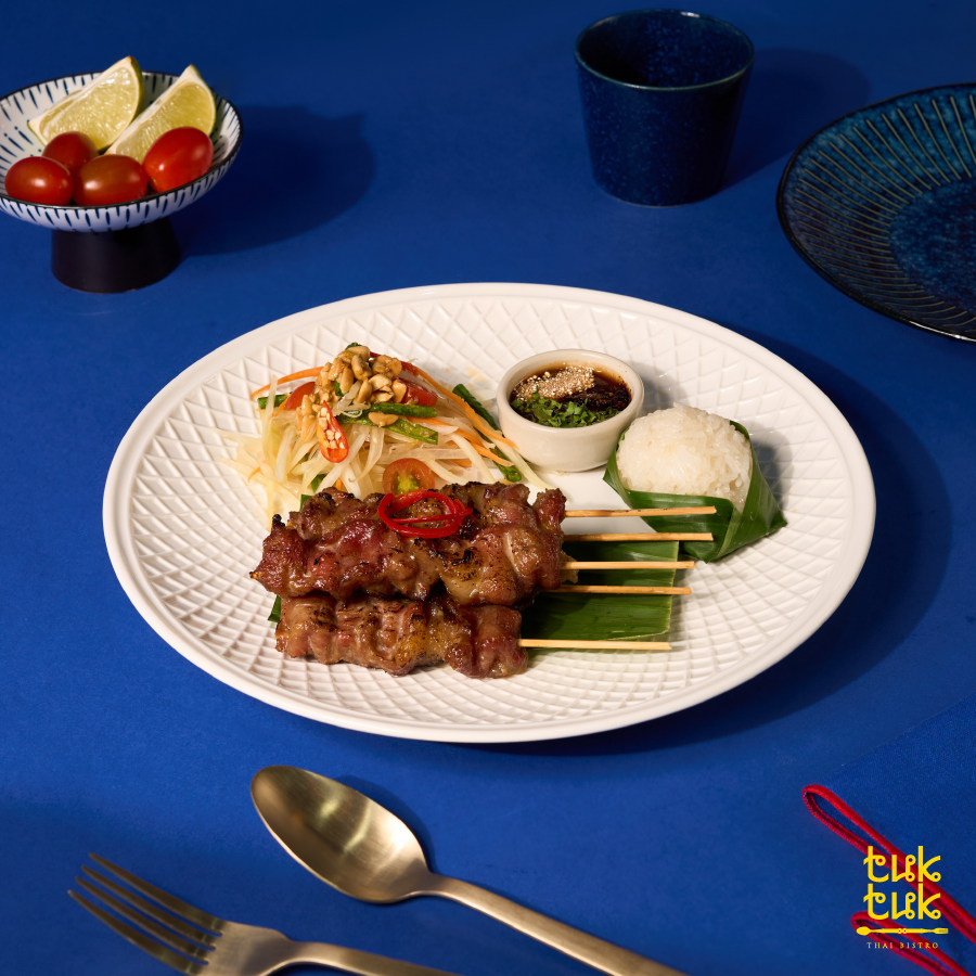 Grilled pork skewer set with papaya salad and sticky rice