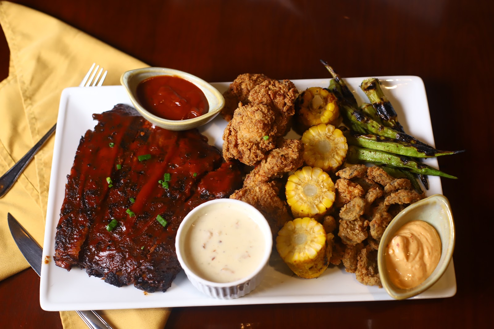 A platter of BBQ ribs and fried chicken