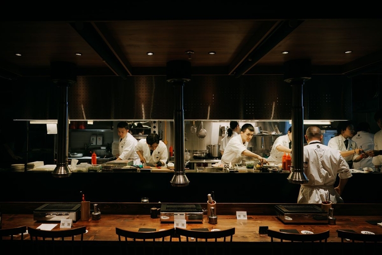 The open kitchen counter with chefs at work